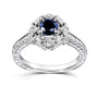 vintage style filigree engagement ring with blue sapphire center and white diamond accents