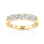 row of five round stones on yellow gold band