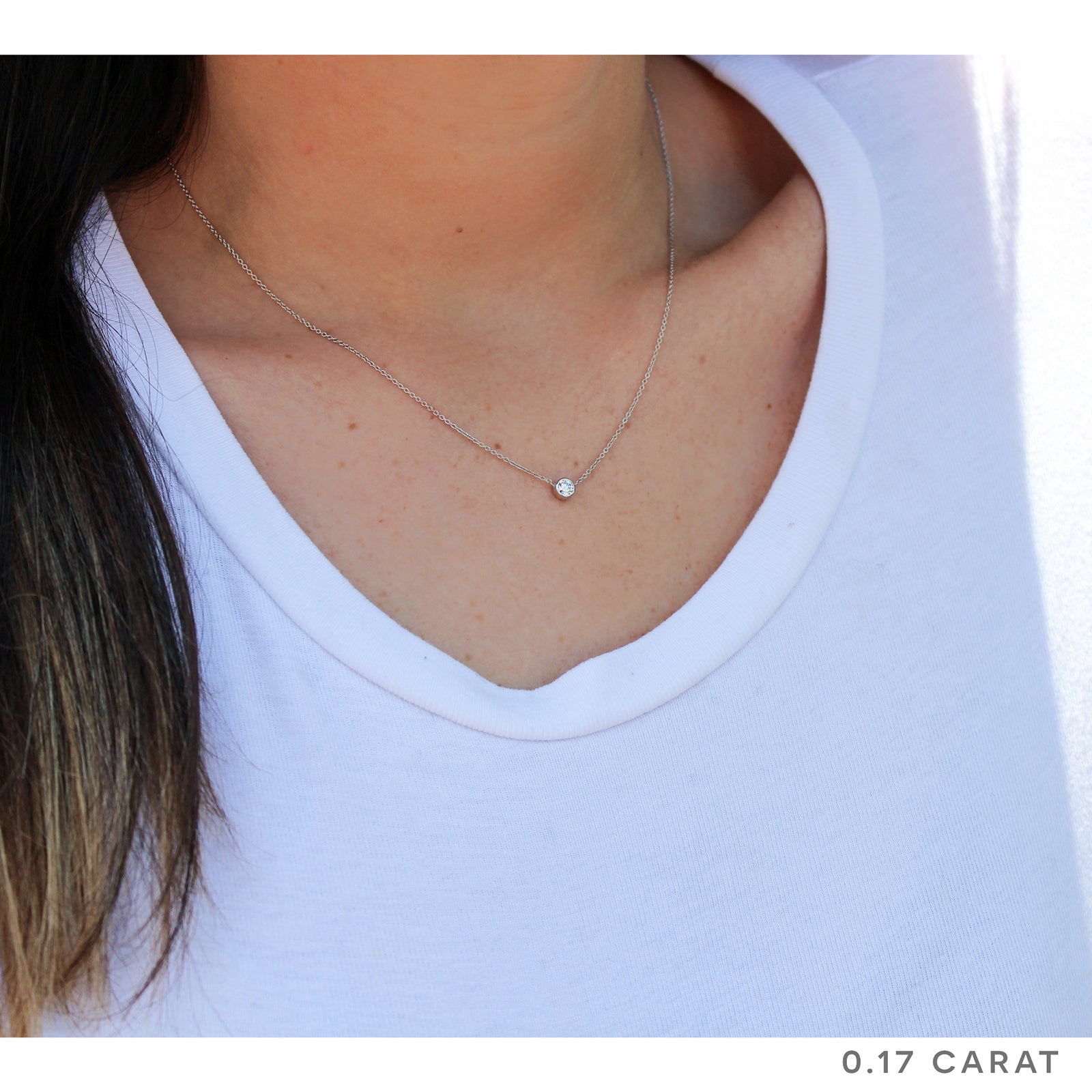 0.17 carat diamond solitaire bezel necklace - sample on a model