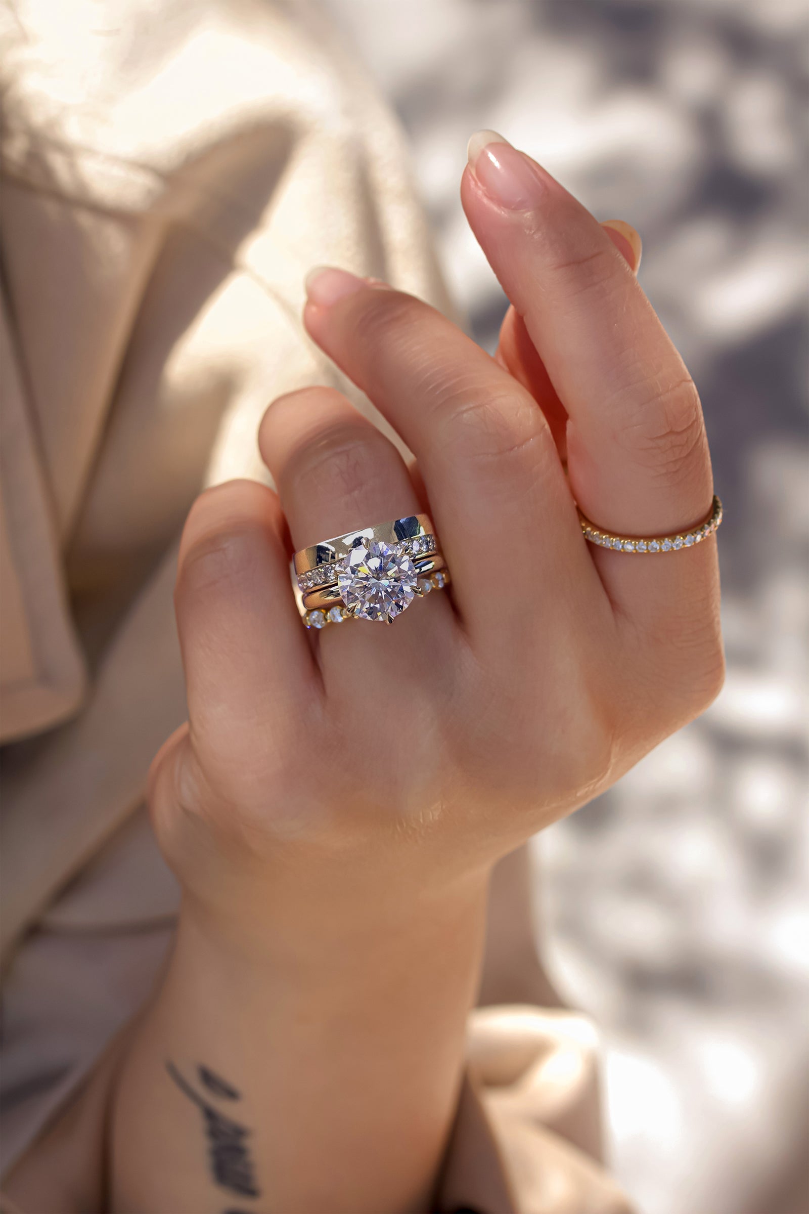 Kobelli's Dorado Bridal Set stacked with our Bubble Ring and Bara Ring on the index