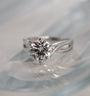solitaire ring on a glass table