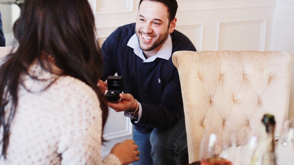 Smiling Boyfriend Proposing With A Kobelli Engagement Ring