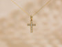 Cross pendant strung to chain