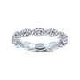 10k white gold diamond eternity band ring with a wavy, scalloped profile and rows of round-cut diamonds