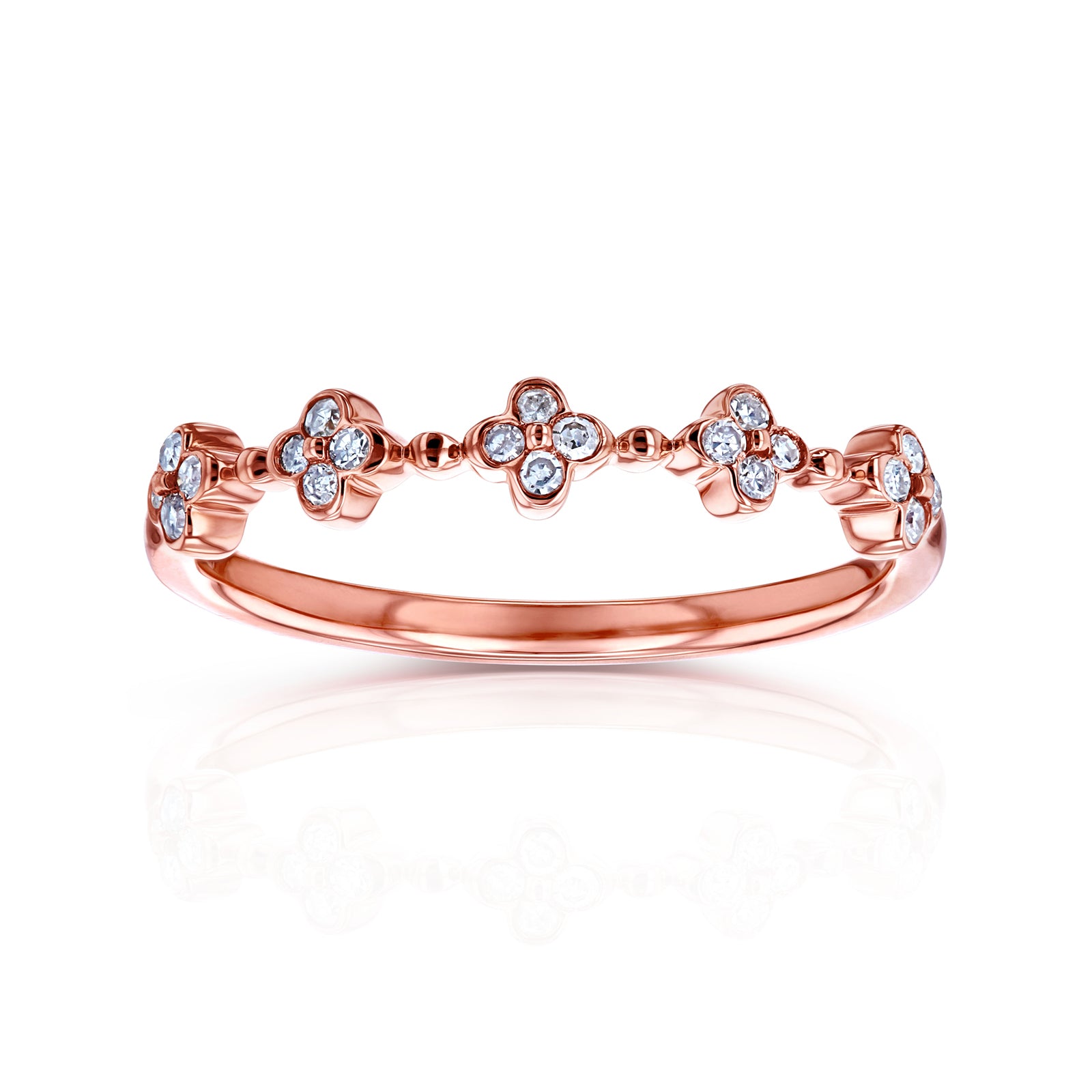 A rose gold band ring featuring a row of small four-petal flower motifs set with clear round diamonds
