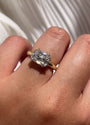Old mine cut diamond set in east-west orientation on platinum and yellow gold ring on Kobelli's hand model.