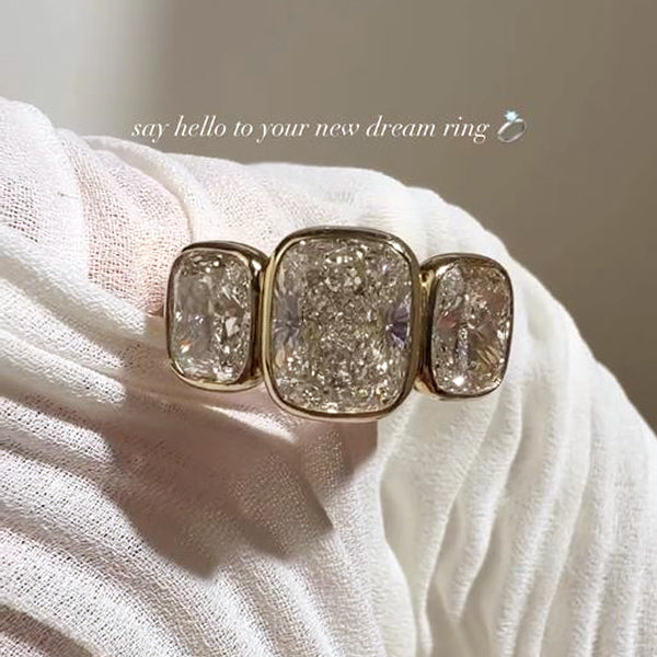 @KOBELLIJEWELRY on Instagram - featured post of the Croft Ring, a cushion shaped brilliant-cut bezel-set 3-stone ring