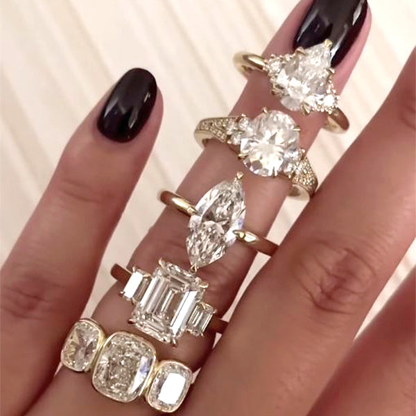 @KOBELLIJEWELRY on Instagram - featured post of various engagement rings on a hand