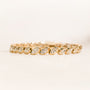8+ Carat Diamond Collet Tennis Hira Bracelet - lifestyle image on a light beige surface