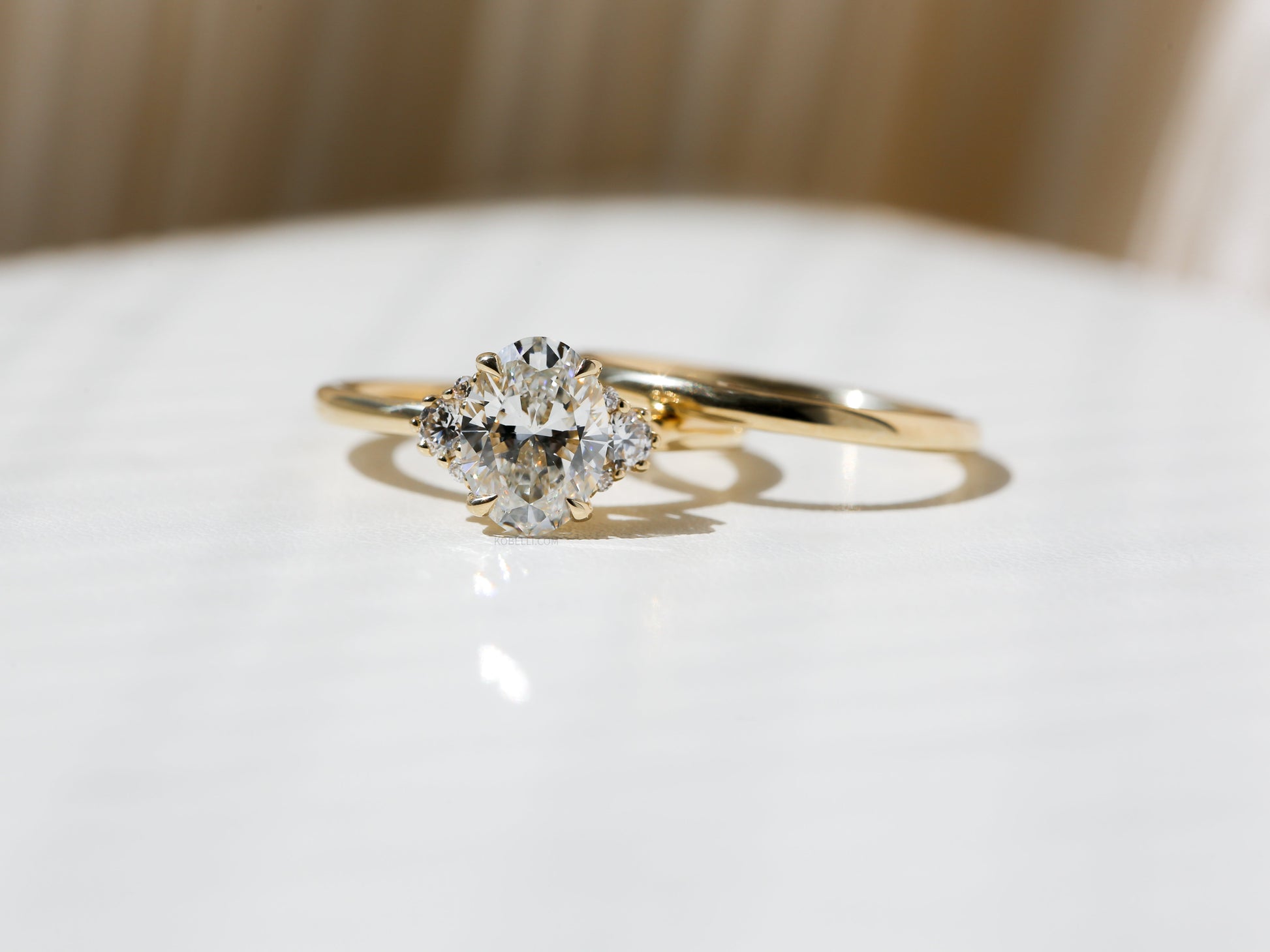 Kobelli Oval Diamond Side Cluster Ethical & Sustainable Wedding Rings