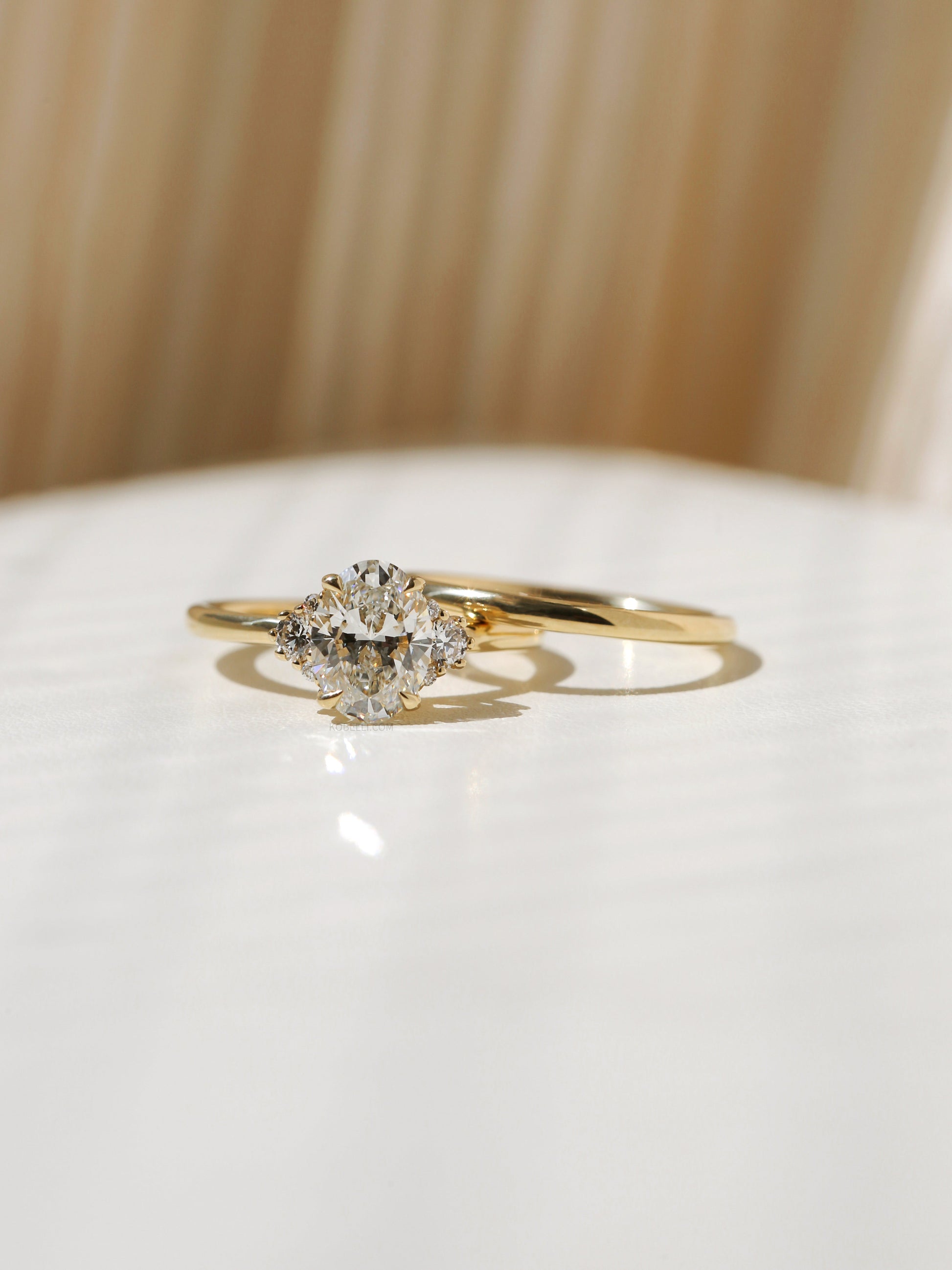 Kobelli Oval Diamond Side Cluster Ethical & Sustainable Wedding Rings