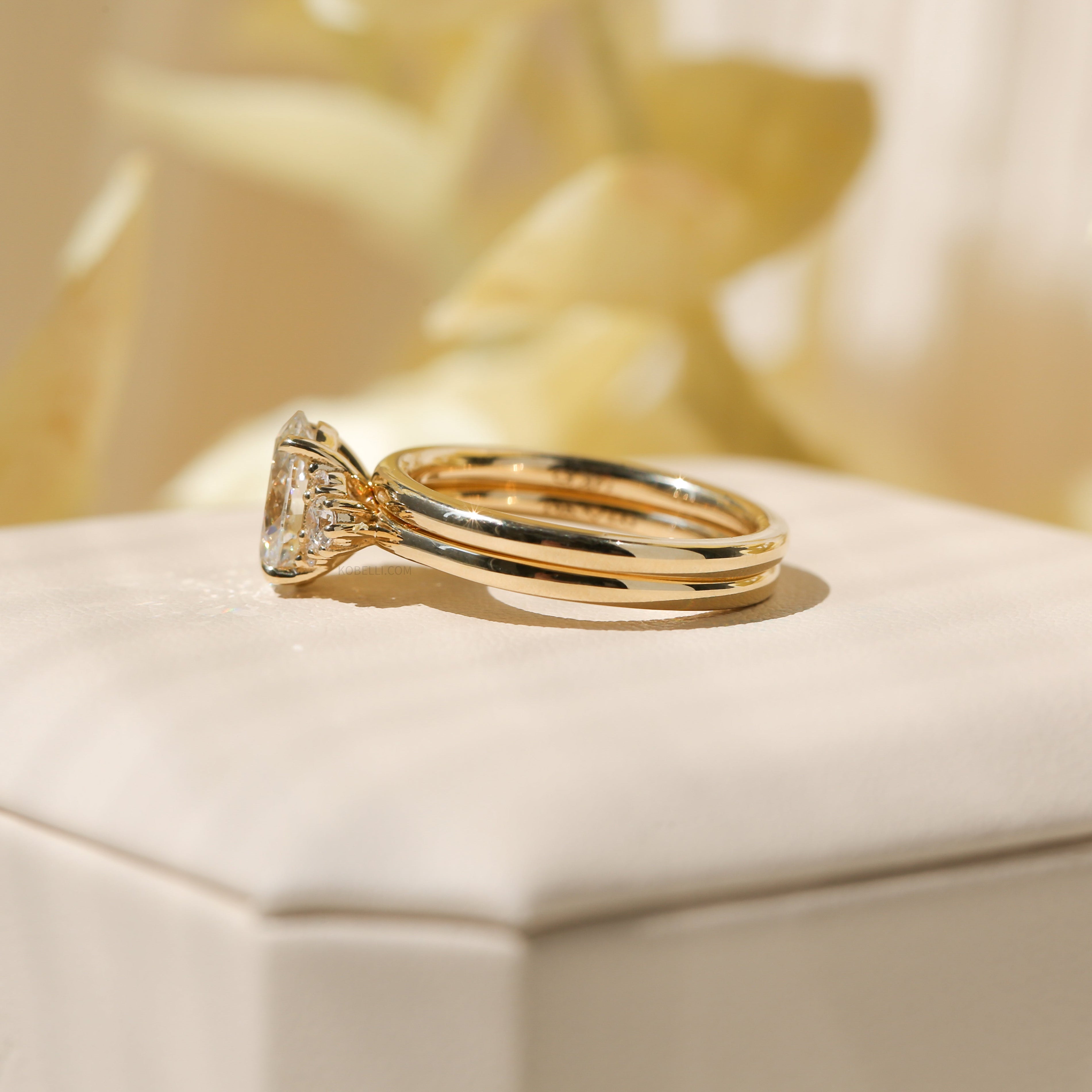 Kobelli Oval Diamond Side Cluster Ethical & Sustainable Wedding Rings