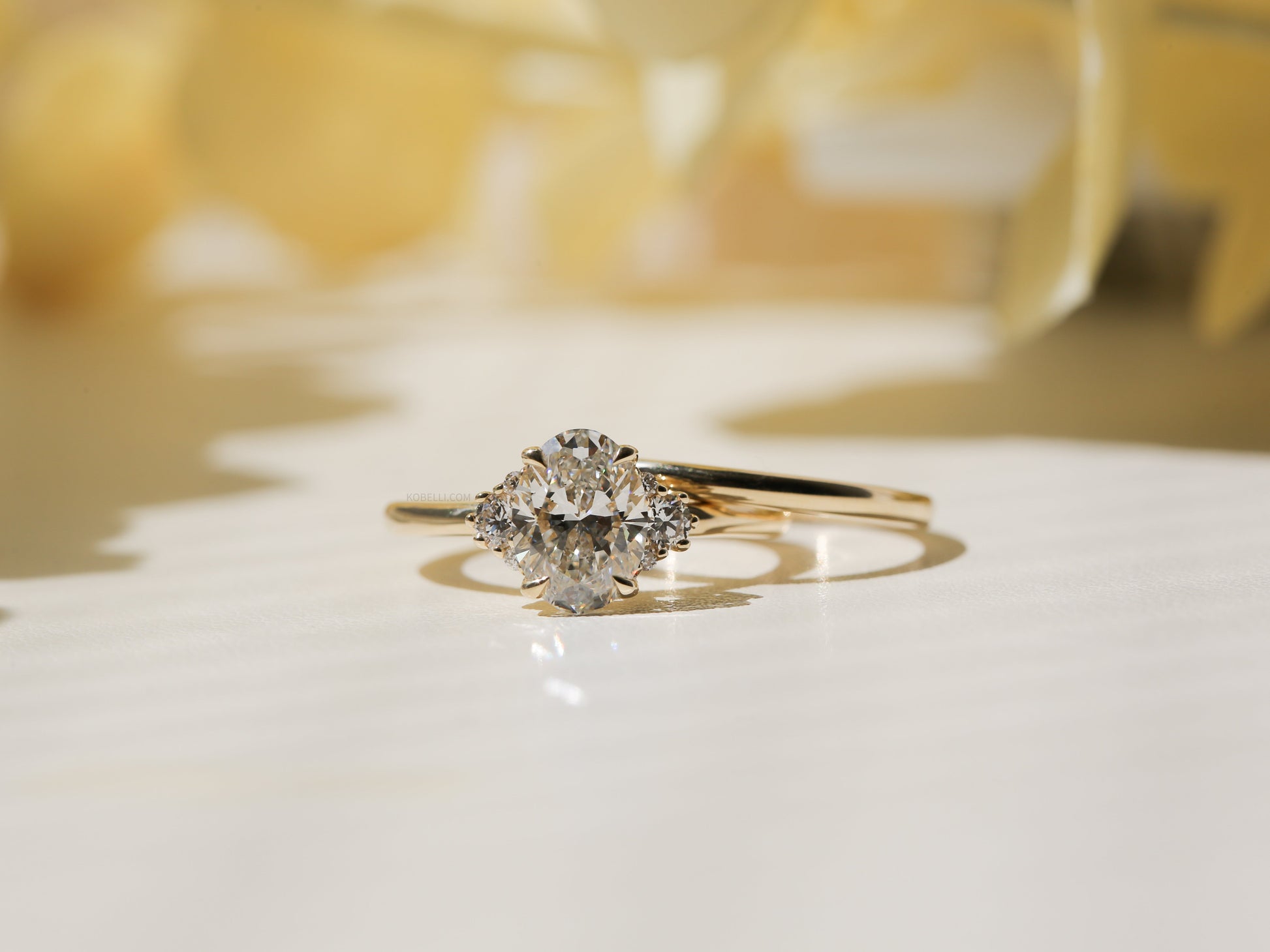 Kobelli Oval Diamond Side Cluster Ethical & Sustainable Wedding Rings