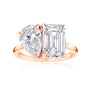 toi et moi ring with two large diamonds, one rectangular shape emerald step-cut, and one pear shape brilliant-cut in rose gold