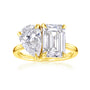 toi et moi ring with two large diamonds, one rectangular shape emerald step-cut, and one pear shape brilliant-cut in yellow gold