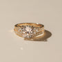 Lifestyle image of the Kobelli Grindelwald 2 Piece Bridal Set - Both rings stacked together; showcases a large cushion brilliant-cut center diamond and pavé-set accent diamonds in solid 14-karat gold - yellow gold option in size 7.5, 3 carat center diamond