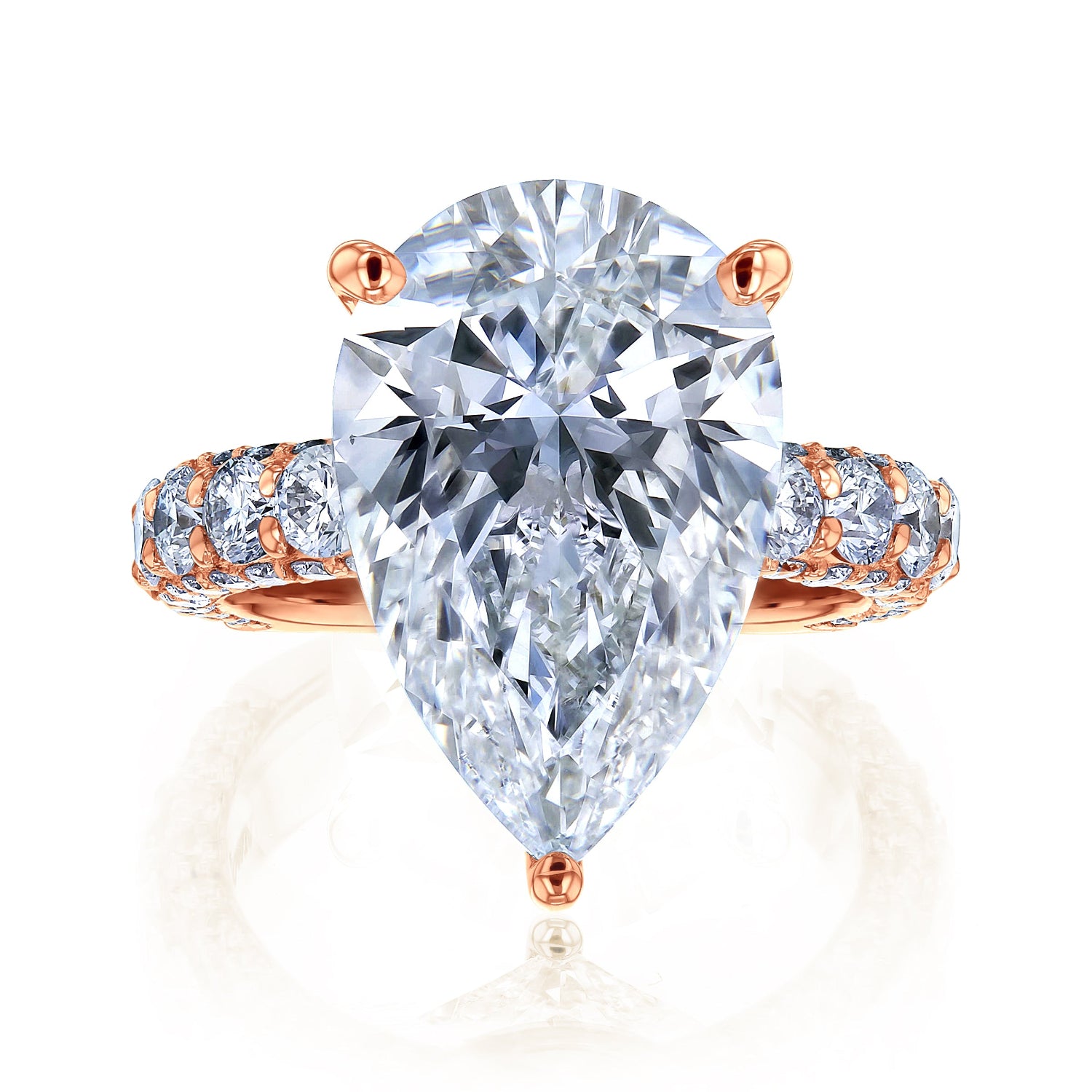 The Beckham Ring in Rose Gold - massive pear-cut white diamond center stone with multiple rows of round white diamonds lining the band
