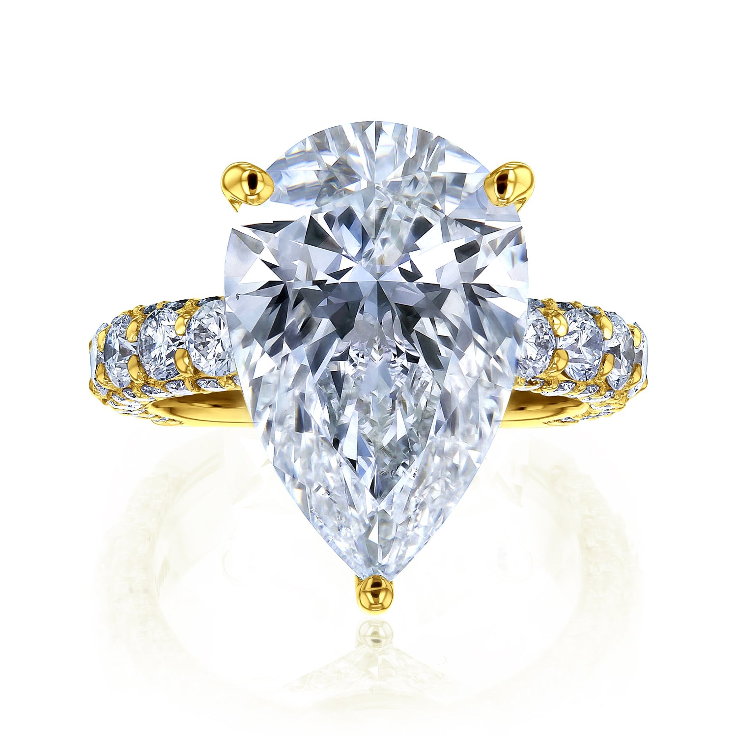The Beckham Ring in Yellow Gold - massive pear-cut white diamond center stone with multiple rows of round white diamonds lining the band