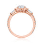 Kobelli Sona Ring - A collect-set oval diamond with tapered baguette side diamonds forming to a classic three-stone design along with a half eternity of round diamonds along the band - rose gold option standing profile view