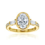Kobelli Sona Ring - A collect-set oval diamond with tapered baguette side diamonds forming to a classic three-stone design along with a half eternity of round diamonds along the band - yellow gold option lifted front view