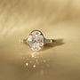 Kobelli Sona Ring - front facing angle on a warm toned tabletop