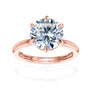 6-prong 3-carat round brilliant ring over solid rose gold band with a hidden halo