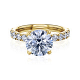 Round center diamond engagement ring in yellow gold