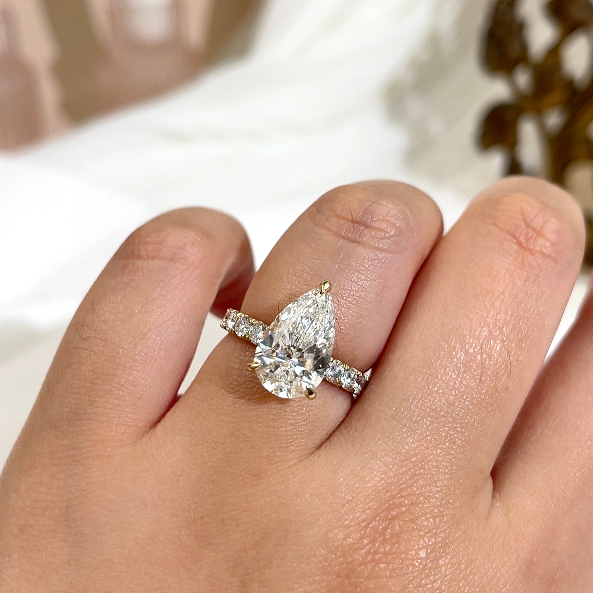 Sample of 4 carat center version of the Fuji ring on a hand in size 7.5