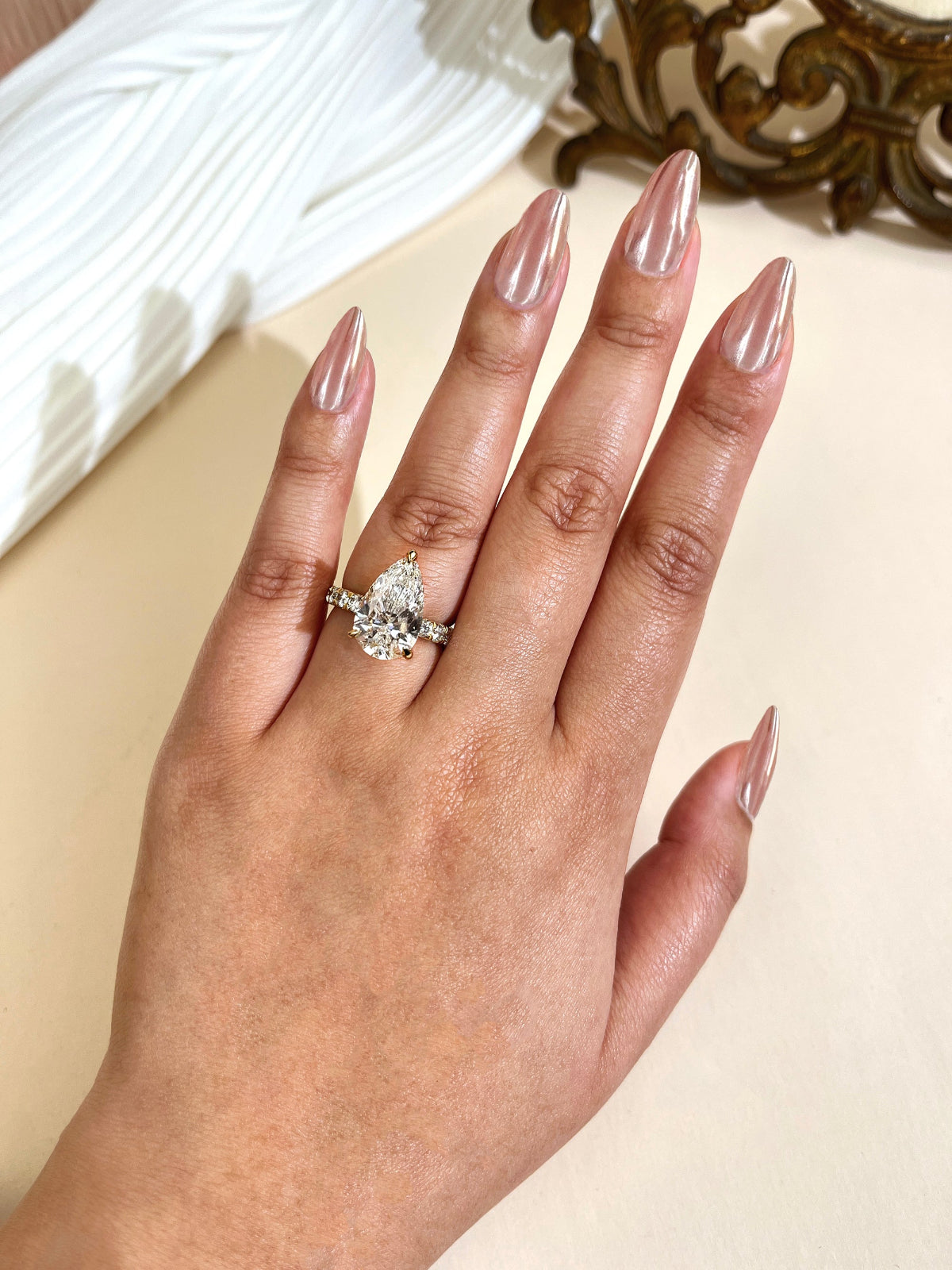 Sample of 4 carat center version of the Fuji ring on a hand in size 7.5 - full hand view