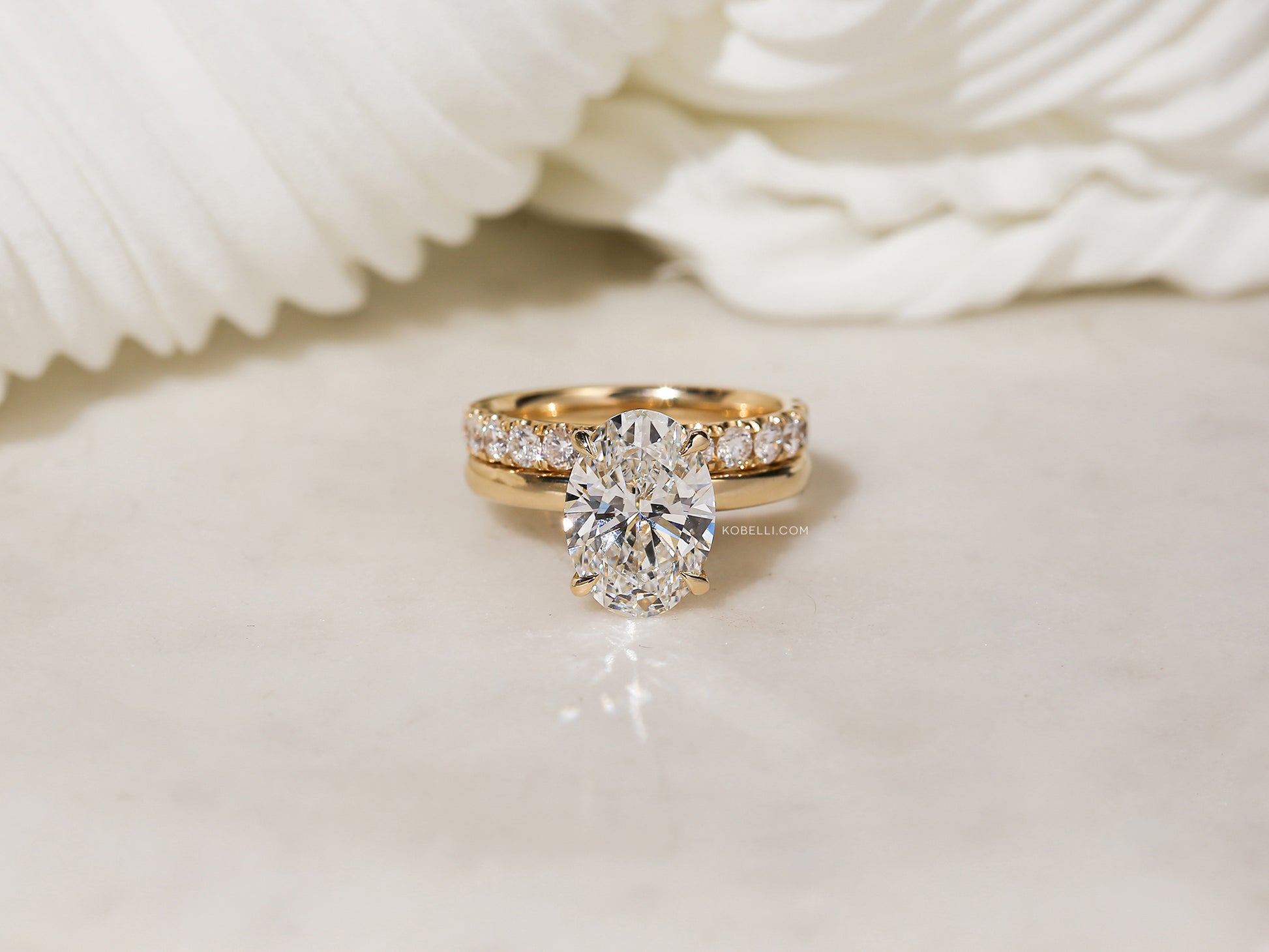 Sample in size 7.5 stacking the Florence Wedding Ring over the Jovie Engagement Ring