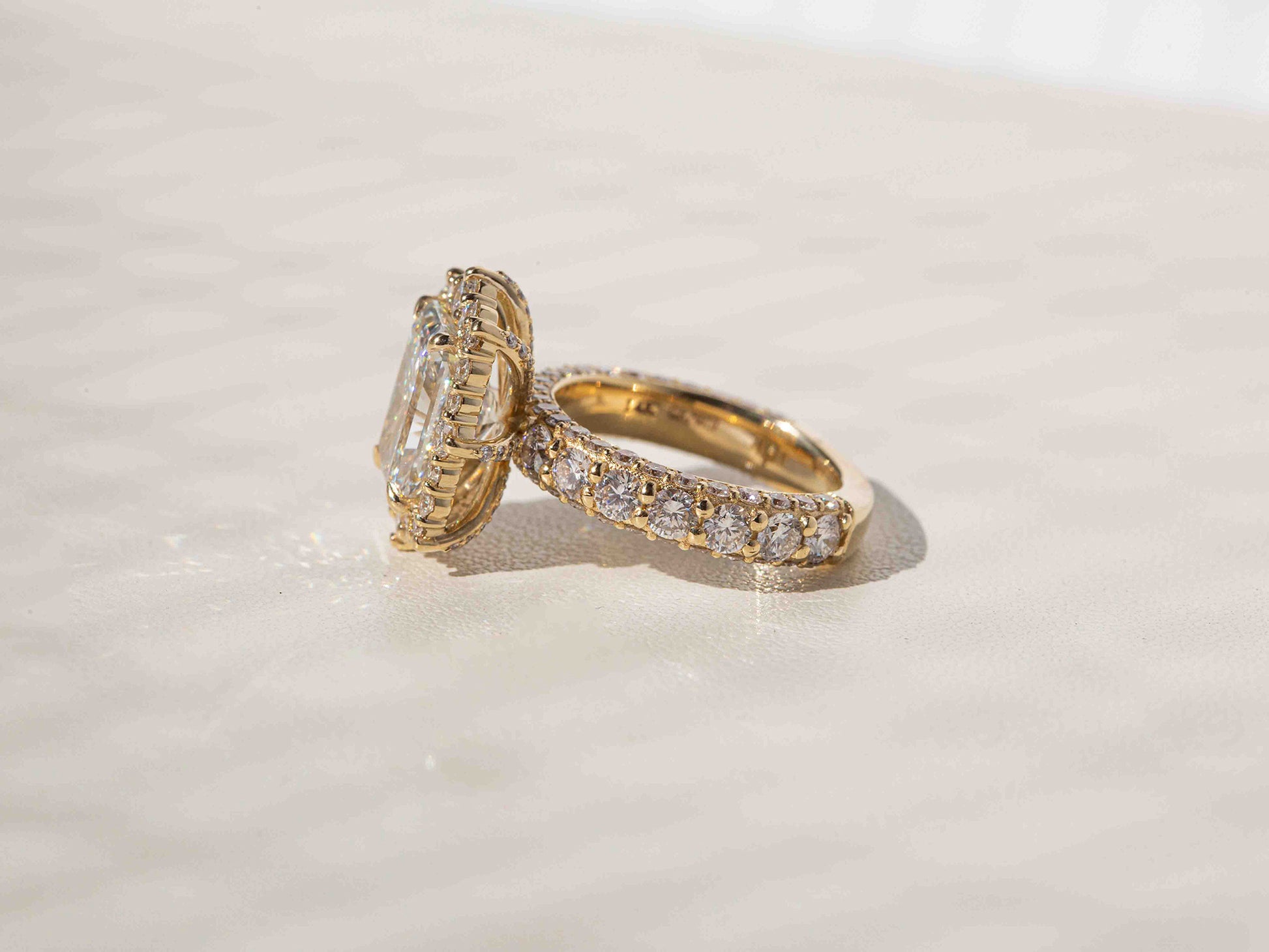 Diamonds run three-quarters down the band in a near-eternity setting