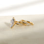 3.25 Carat Lab Grown Diamond Marquise Shifting Helix Ring paired to the Shifting Helix Wedding Band Ring - side angle resting on a white table