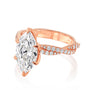 Kobelli Helix Ring in rose gold with a large marquise diamond and smaller round diamonds on the band against a white background