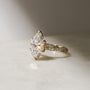 3.5 Carat Lab Grown Diamond Marquise Double Helix Ring Solid 14k Yellow Gold - lifestyle image resting on a table in indirect sunlight