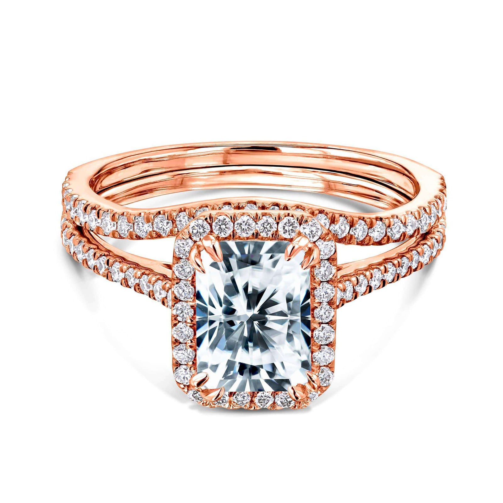 radiant-cut moissanite center with diamond side stones forming to a halo over a near eternity band in 14k rose gold + a matching contoured wedding band that flows outwards under the center setting