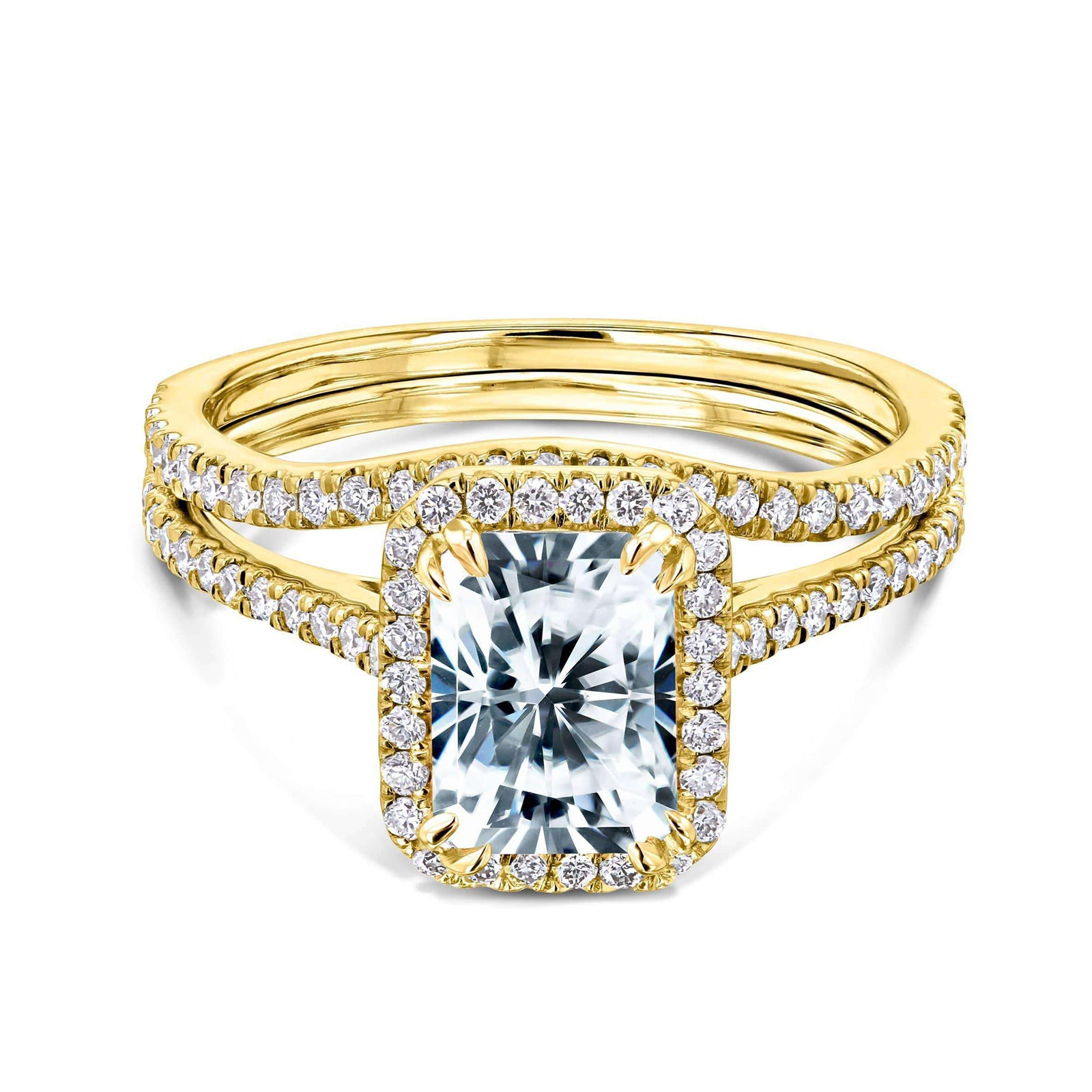 radiant-cut moissanite center with diamond side stones forming to a halo over a near eternity band in 14k yellow gold + a matching contoured wedding band that flows outwards under the center setting
