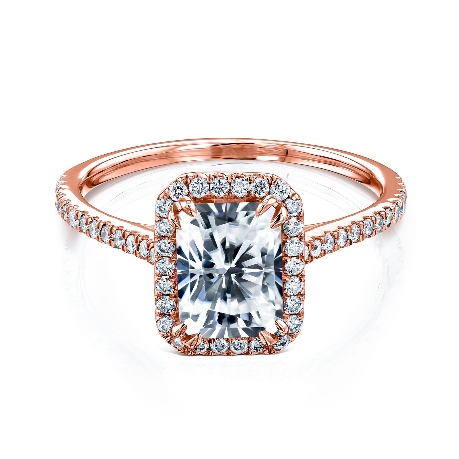 radiant-cut moissanite center with diamond side stones forming to a halo over a near eternity band in 14k rose gold