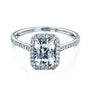 radiant-cut moissanite center with diamond side stones forming to a halo over a near eternity band in 14k white gold