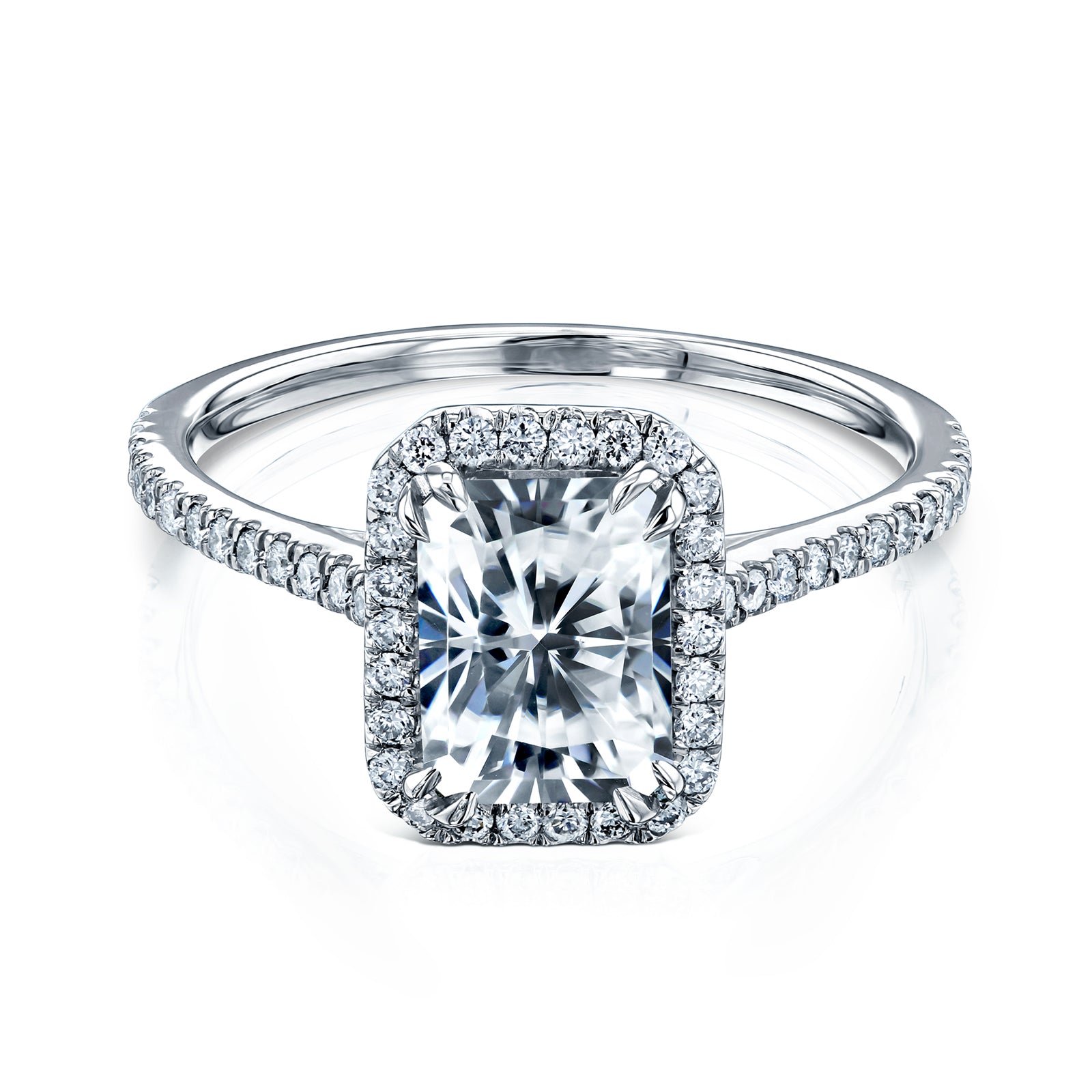 radiant-cut moissanite center with diamond side stones forming to a halo over a near eternity band in 14k white gold