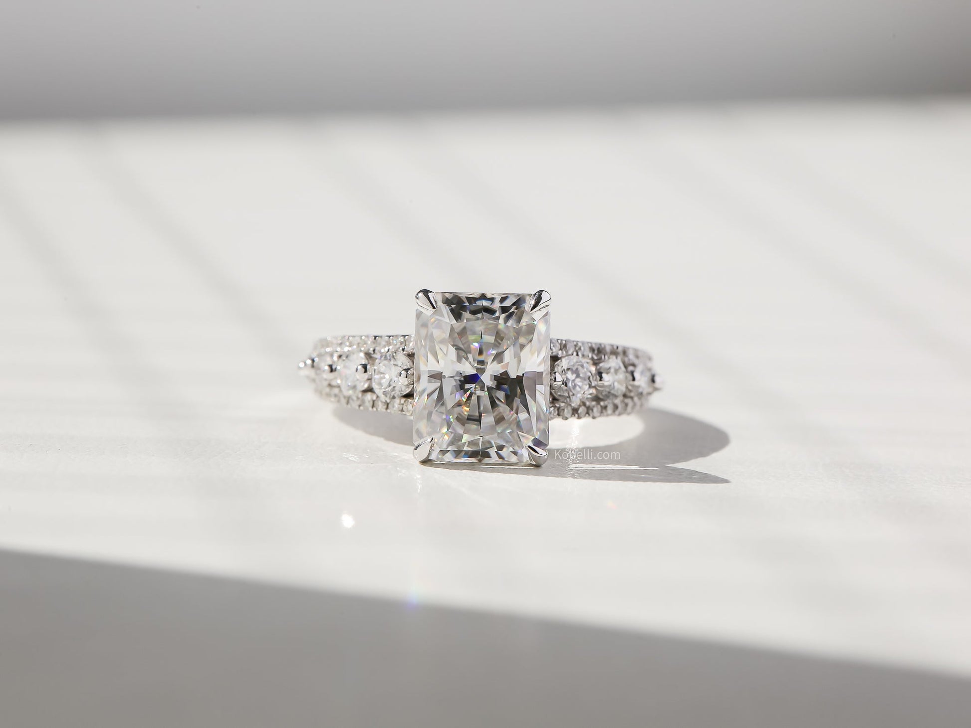 Kobelli Radiant Moissanite & Round Diamonds Triple Row Engagement Ring