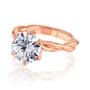 Kobelli Helix Ring in rose gold with a large round diamond held with 6 prongs over a solid gold twist band.