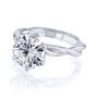 Kobelli Helix Ring in white gold with a large round diamond held with 6 prongs over a solid gold twist band.