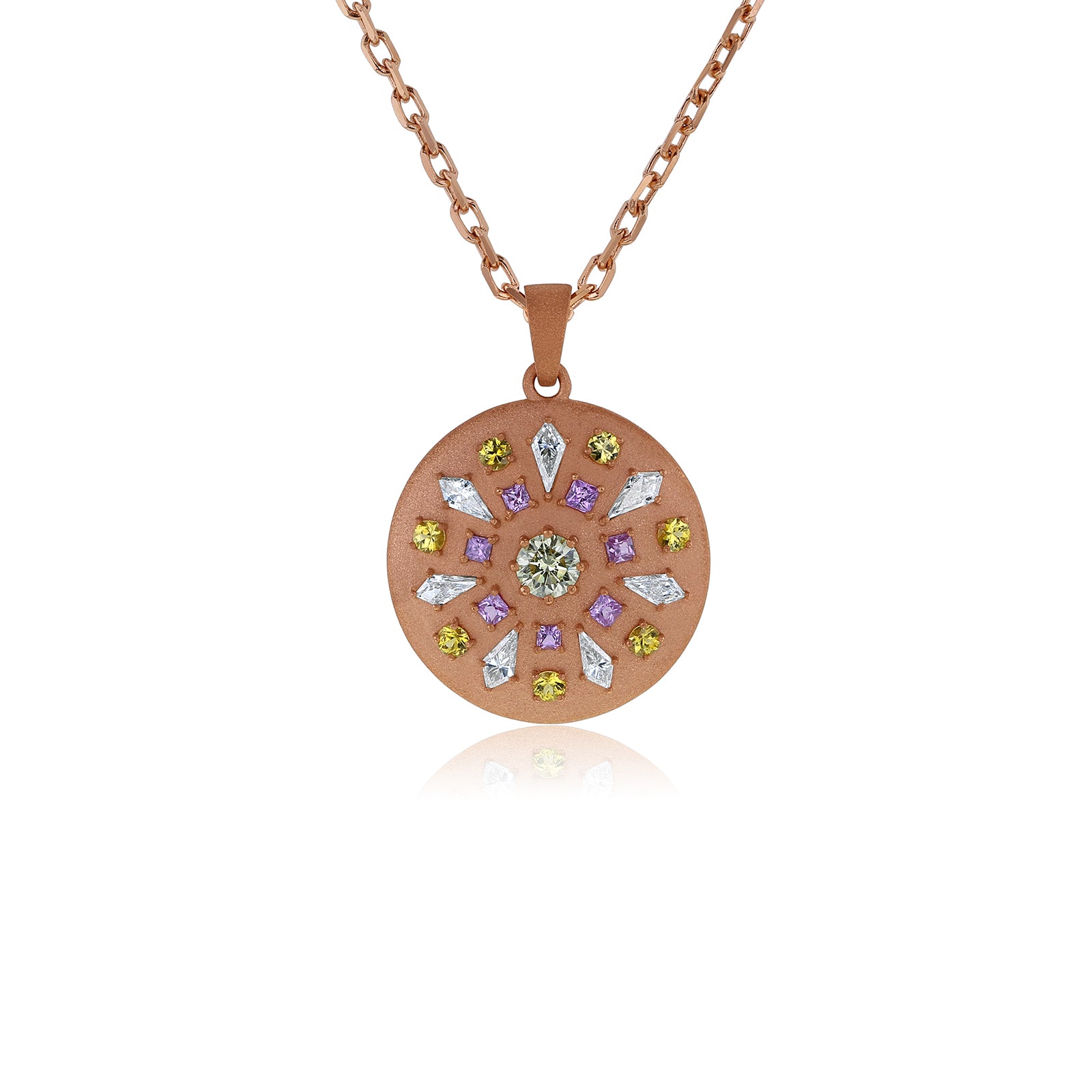 A rose gold circular pendant necklace featuring a floral mandala design with a central round diamond and surrounding marquise-cut diamonds in yellow, purple, and white, suspended from a delicate rose gold chain on a white background.
