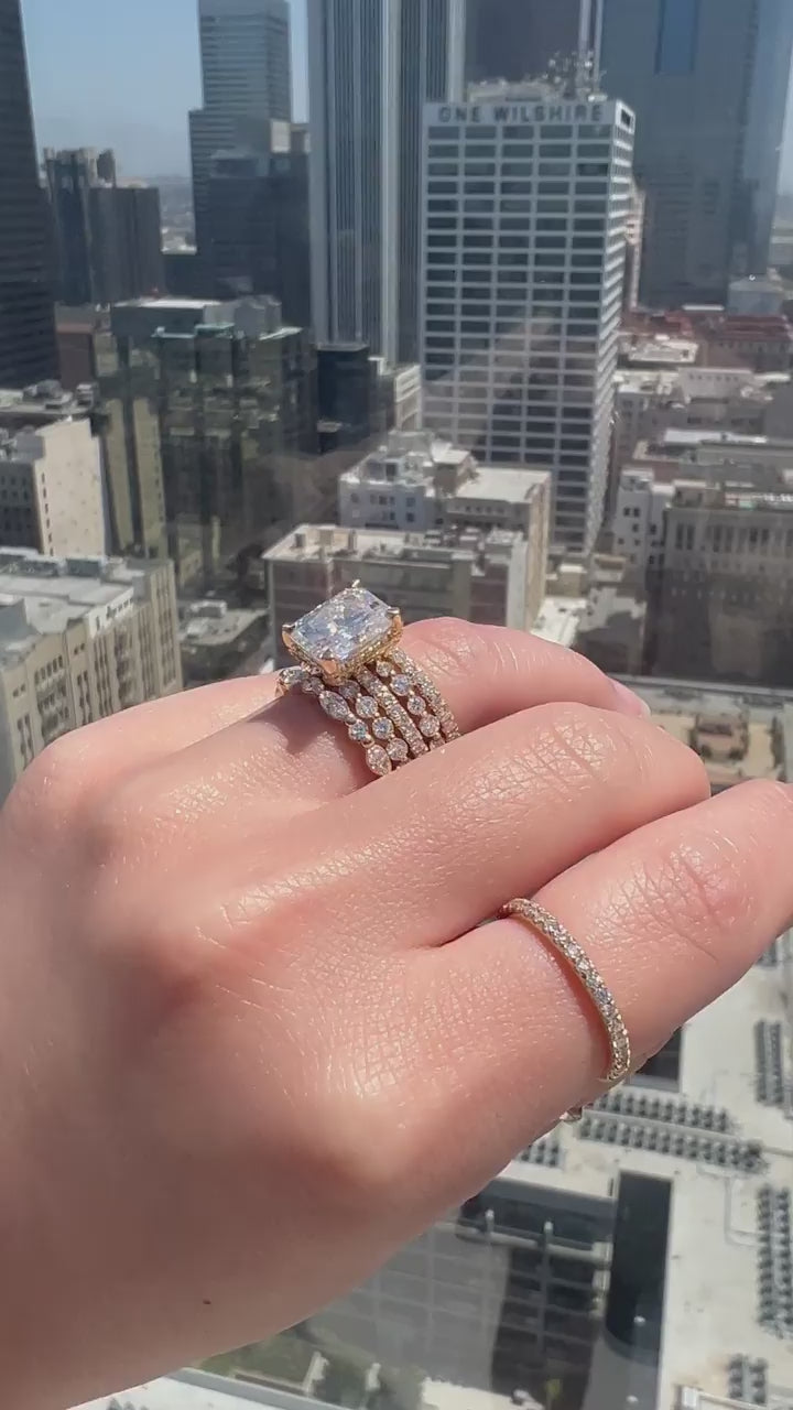 video of The Kobelli Riri Ring stacked with several 2 mm yellow gold bands, recorded on a downtown Los Angeles rooftop