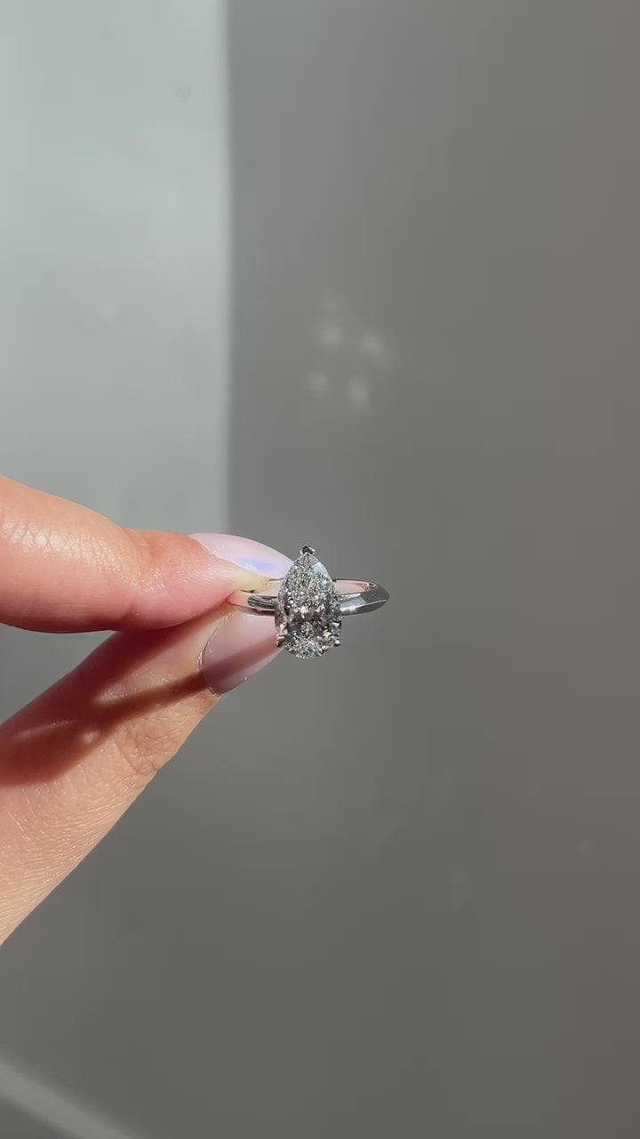 video of pear diamond ring with knife edge band