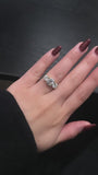 video of 2.5 Carat Moissanite Round 3-Stone Caitlin Ring on a hand