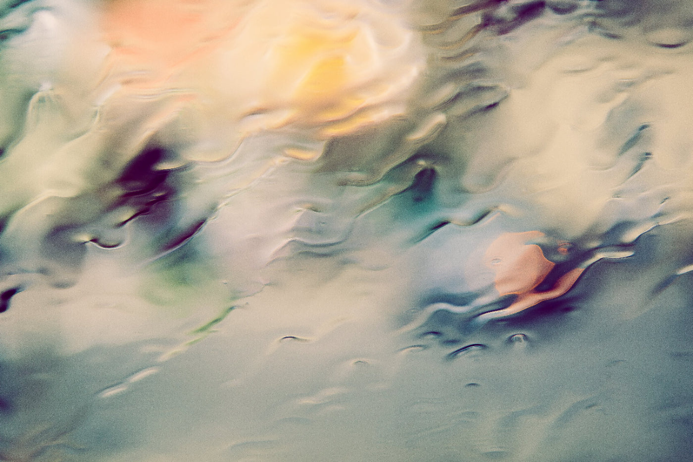 backdrop image of rainwater flowing down a window