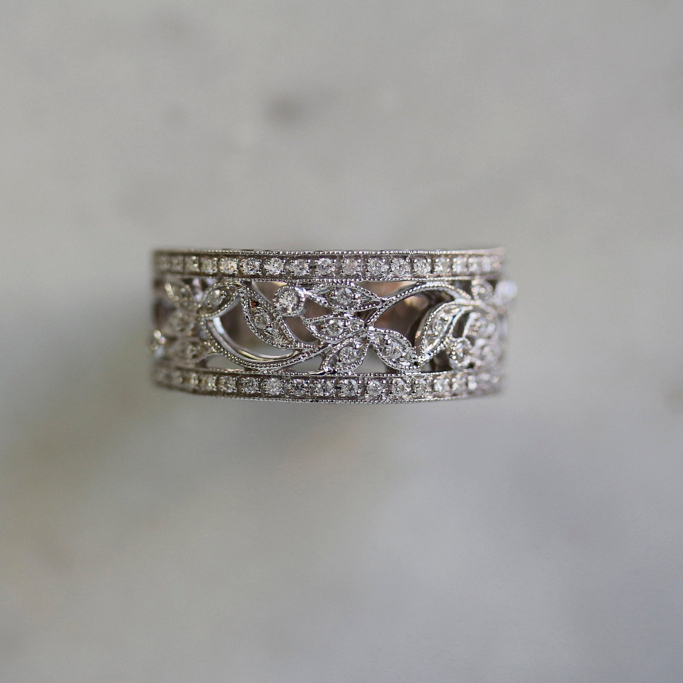 floral filigree milestone ring in natural lighting