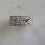 floral filigree milestone ring in natural lighting