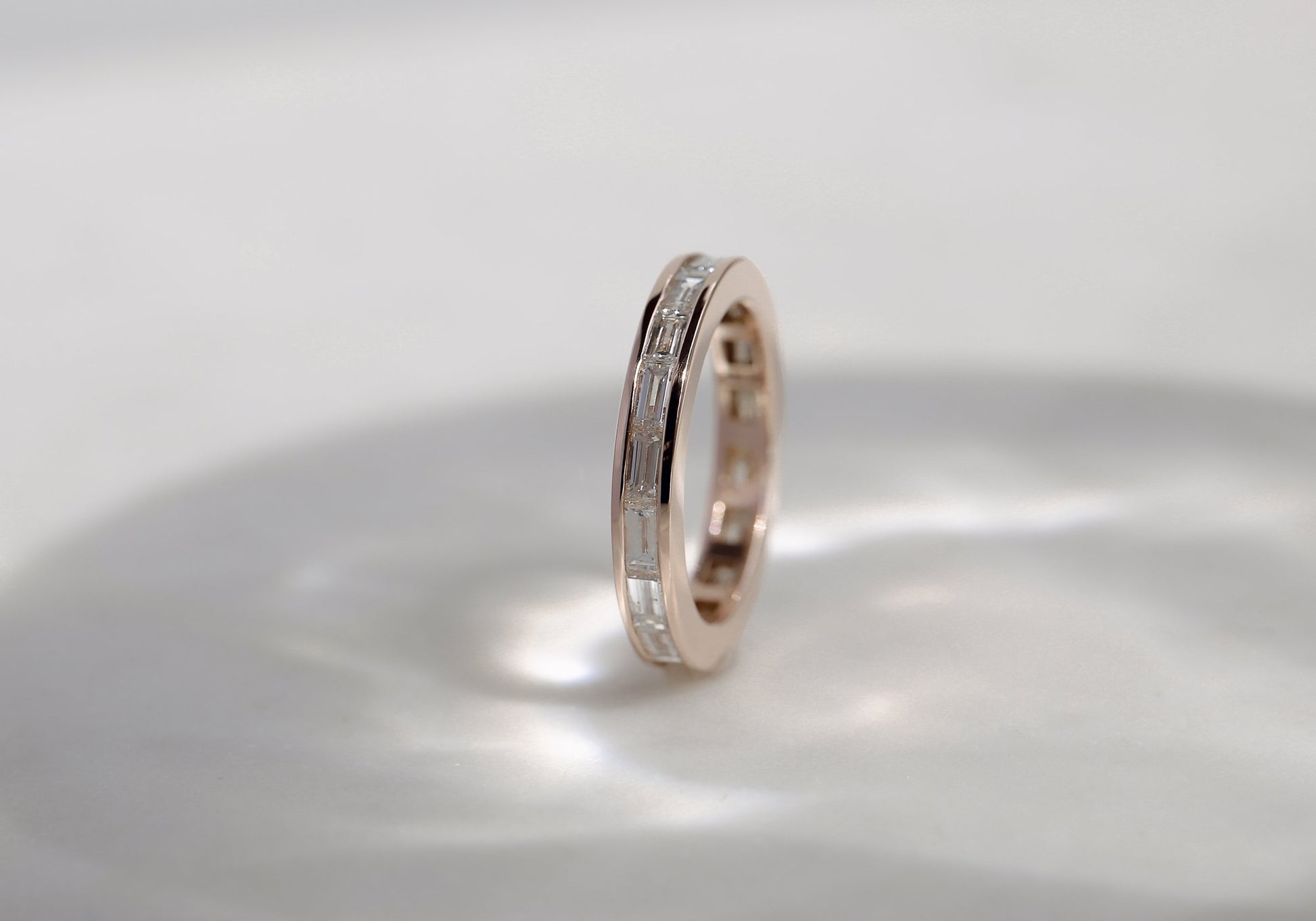 Kobelli Straight Baguette Eternity Band in Channel Setting